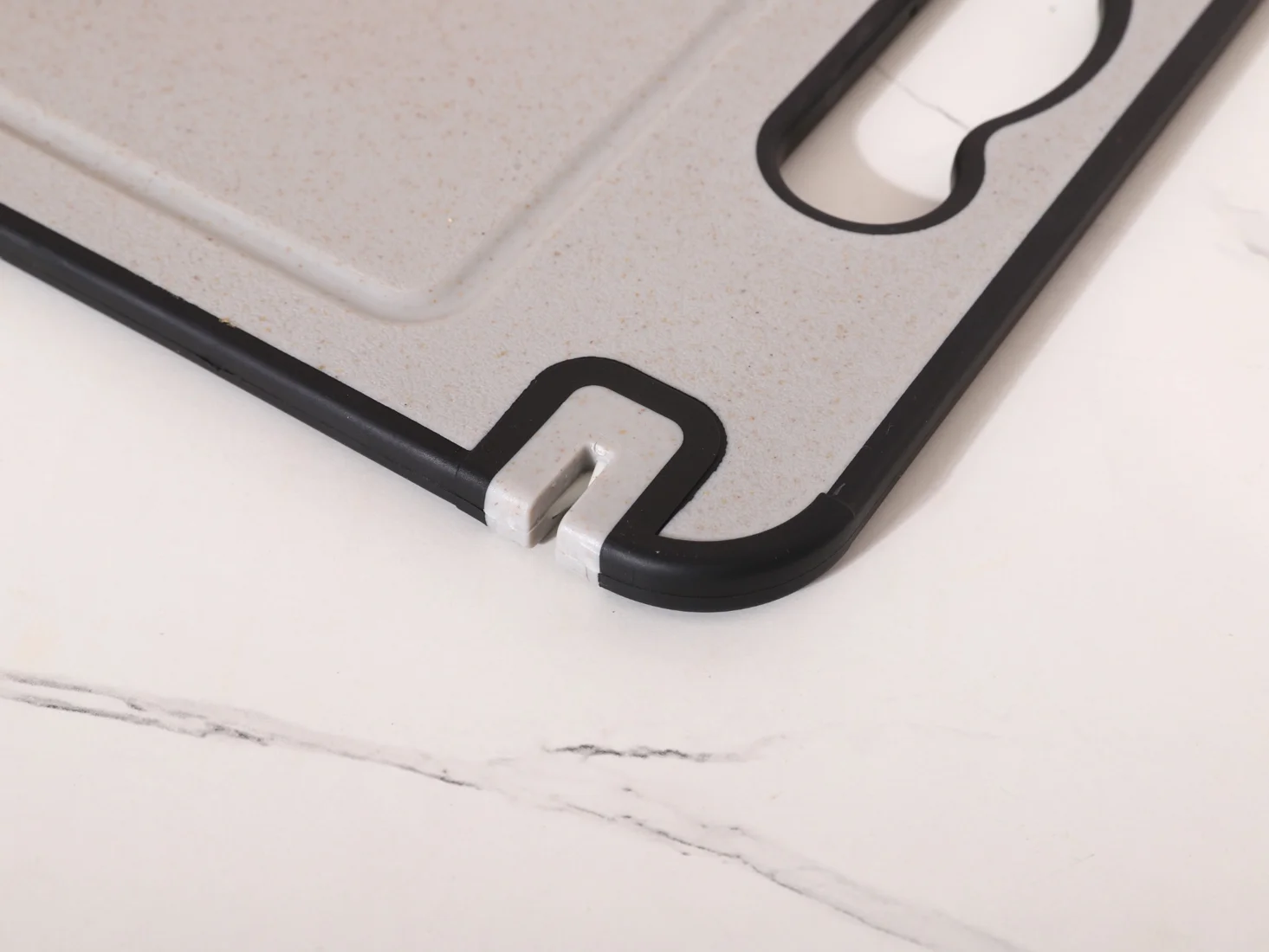 Close view of TIBO Cutting Board handle and integrated tool area