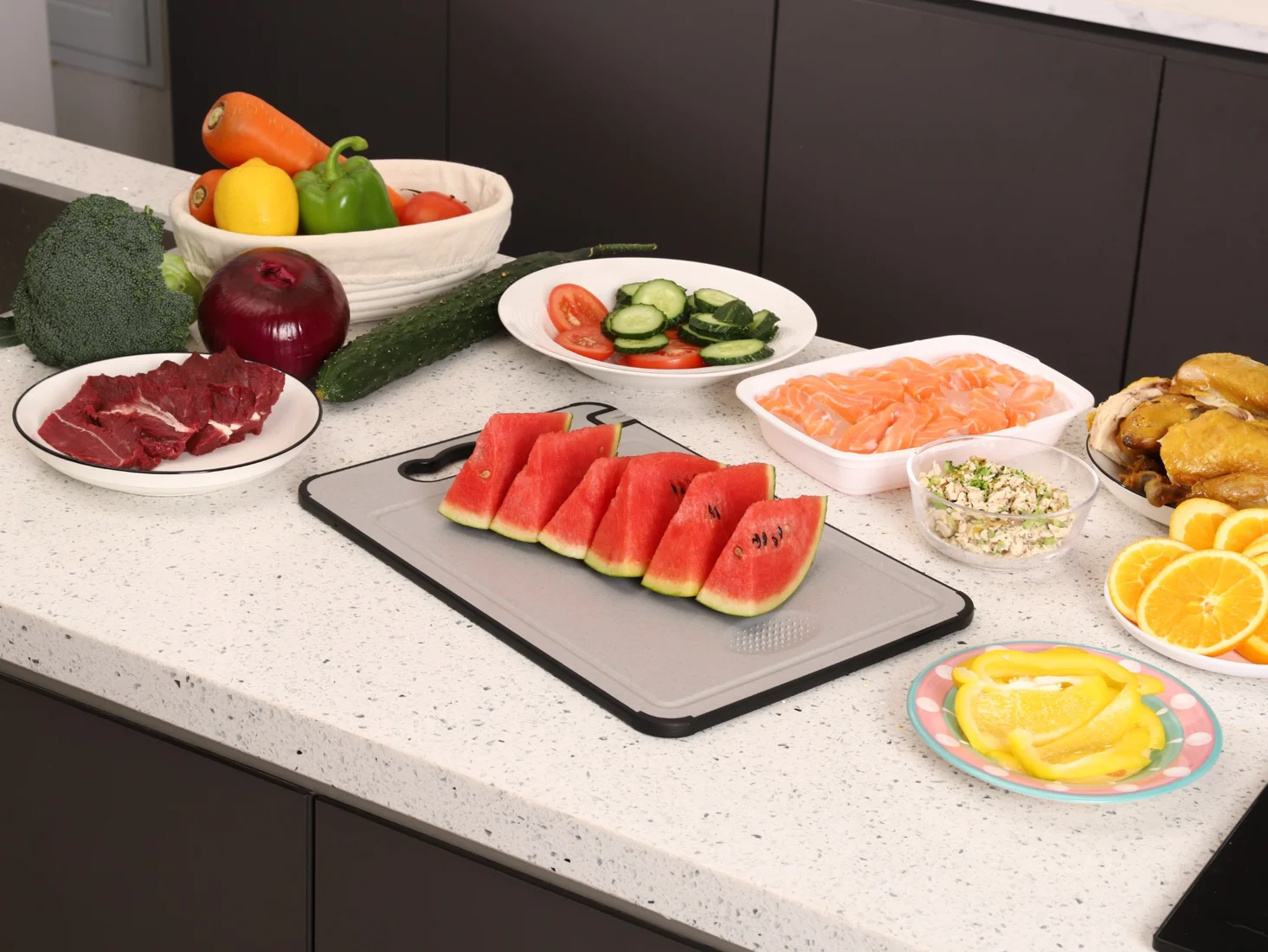 TIBO Cutting Board on a kitchen counter with prepared fruit and ingredients